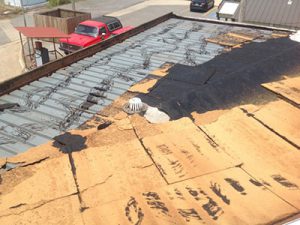 Wind damaged roof repair by Dayton Commercial Services